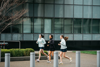 Three women running in downtown Buffalo