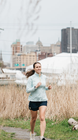 Women running in Middle Trail apparel