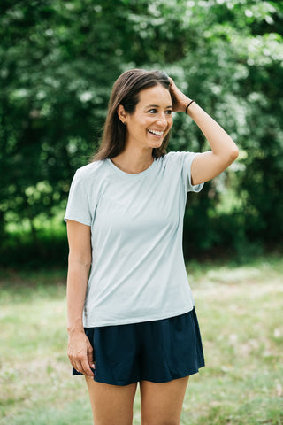 This women’s running shirt includes a lightweight, moisture-wicking fabric that is breathable. Running t-shirt comes in colors misty morning sky blue or sage green.