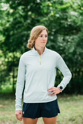This women’s running quarter zip top is ultra-soft and made with a moisture-wicking fabric so it’s perfect for all running seasons. Quarter zip comes in colors black and misty morning sky blue.