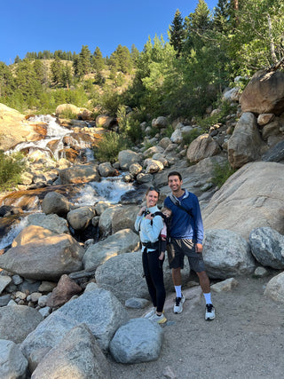 Molly Curry and her husband Matthew Strauss hiking with their baby daughter.