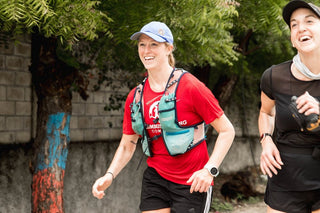 Jackie Whelan smiling and running through the streets of Haiti during her 200-mile Ultra Marathon.
