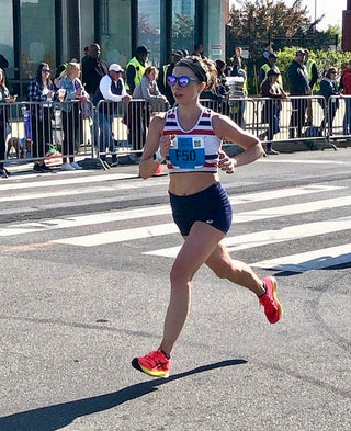 Mackenzie Lowe running during a half marathon race