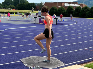 Mackenzie Lowe strength training on a track.