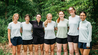 Group of women in running apparel posing together