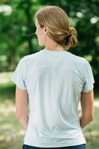 This women’s running shirt includes a lightweight, moisture-wicking fabric that is breathable. Running t-shirt comes in colors misty morning sky blue or sage green.