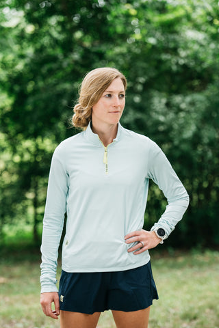 This women’s running quarter zip top is ultra-soft and made with a moisture-wicking fabric so it’s perfect for all running seasons. Quarter zip comes in colors black and misty morning sky blue. 