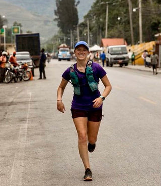 Jackie Murrer running through the streets of Haiti during her 200-mile Ultra Marathon. 